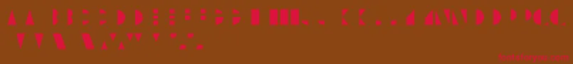 UnicumcolorRegular Font – Red Fonts on Brown Background