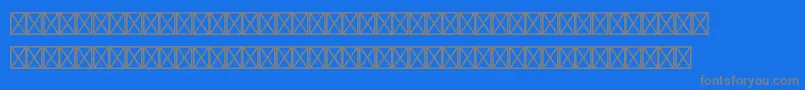 フォントCaravanltstd1 – 青い背景に灰色の文字