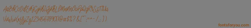 SlainteScriptDemo-Schriftart – Braune Schriften auf grauem Hintergrund