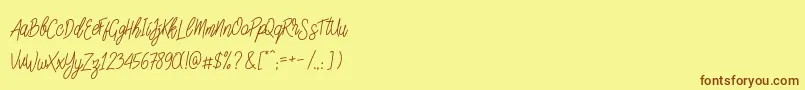 SlainteScriptDemo-Schriftart – Braune Schriften auf gelbem Hintergrund
