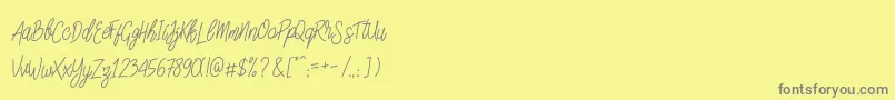 SlainteScriptDemo-Schriftart – Graue Schriften auf gelbem Hintergrund