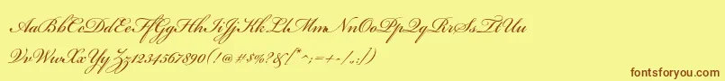 フォントBickhamscriptproRegular – 茶色の文字が黄色の背景にあります。