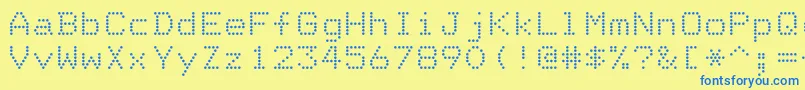 DotriceRegular-Schriftart – Blaue Schriften auf gelbem Hintergrund