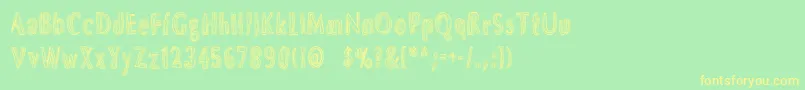 フォントDsbrushs – 黄色の文字が緑の背景にあります