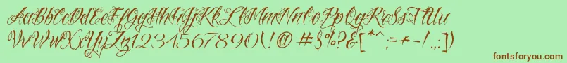 Fonte VtcNuetattooscript – fontes marrons em um fundo verde