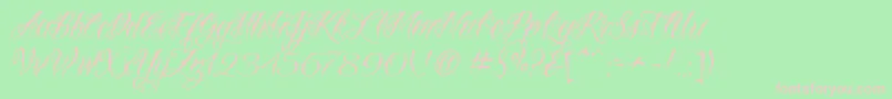 VtcNuetattooscript-Schriftart – Rosa Schriften auf grünem Hintergrund