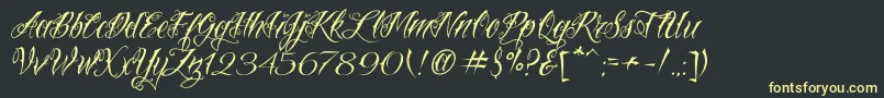 VtcNuetattooscript Font – Yellow Fonts on Black Background