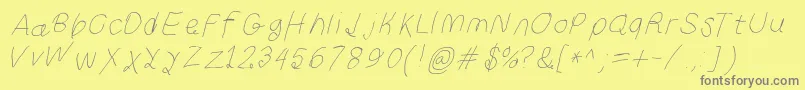 Curlykuethinita-Schriftart – Graue Schriften auf gelbem Hintergrund