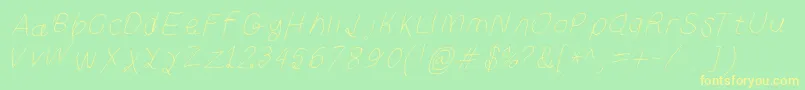 フォントCurlykuethinita – 黄色の文字が緑の背景にあります