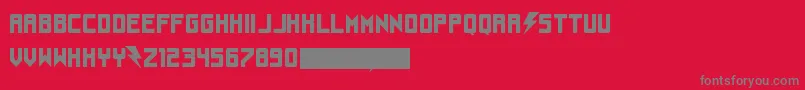 Understrukkフォントについての詳細 フォントUnderstrukk – 赤い背景に灰色の文字