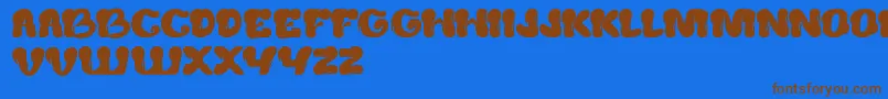 CreamyButter Font – Brown Fonts on Blue Background