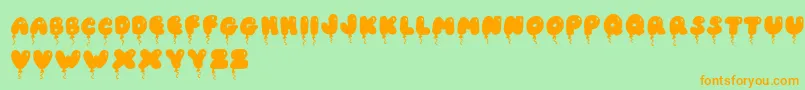 JiSolidBalloonCaps Font – Orange Fonts on Green Background