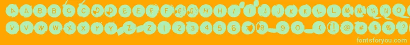 Backspacerround-Schriftart – Grüne Schriften auf orangefarbenem Hintergrund