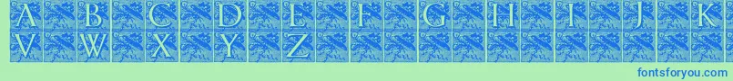 フォントPompadourinitials – 青い文字は緑の背景です。