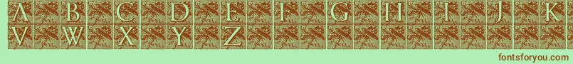 フォントPompadourinitials – 緑の背景に茶色のフォント