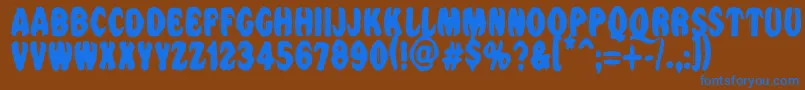 Vtcnightofthedrippybentcaps Font – Blue Fonts on Brown Background