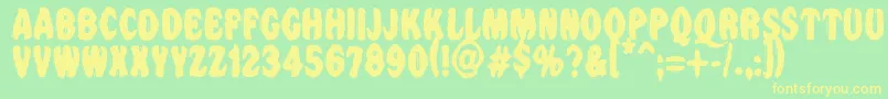 Vtcnightofthedrippybentcaps Font – Yellow Fonts on Green Background