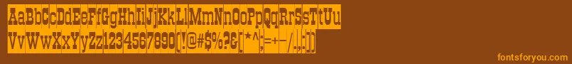 TraktircameoNormal Font – Orange Fonts on Brown Background