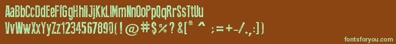 フォントPressStyle – 緑色の文字が茶色の背景にあります。