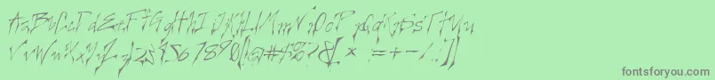 フォントCreelo – 緑の背景に灰色の文字