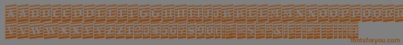 Шрифт ATrianglercmmrup – коричневые шрифты на сером фоне
