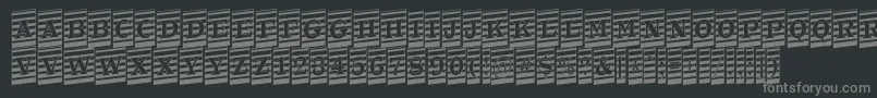 ATrianglercmmrup-fontti – harmaat kirjasimet mustalla taustalla
