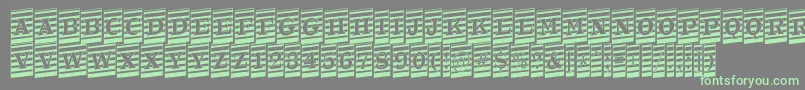 Шрифт ATrianglercmmrup – зелёные шрифты на сером фоне