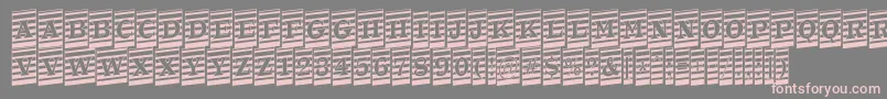 フォントATrianglercmmrup – 灰色の背景にピンクのフォント