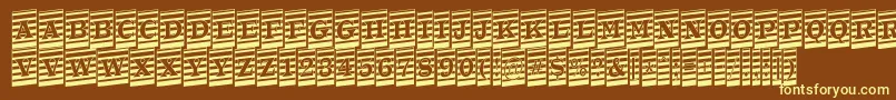 ATrianglercmmrup-fontti – keltaiset fontit ruskealla taustalla