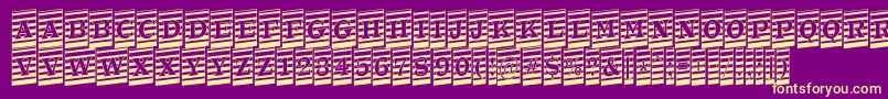 フォントATrianglercmmrup – 紫の背景に黄色のフォント