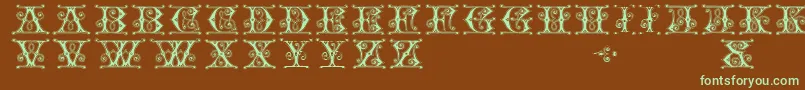 フォントGingerbreadInitials – 緑色の文字が茶色の背景にあります。