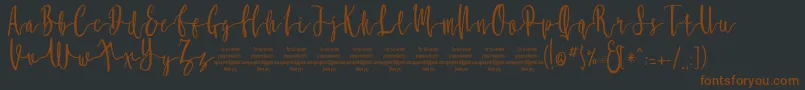 MollucaFree Font – Brown Fonts on Black Background