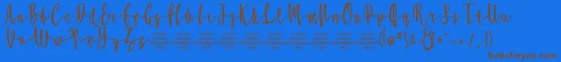 MollucaFree Font – Brown Fonts on Blue Background