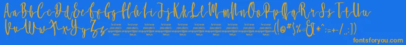 MollucaFree-Schriftart – Orangefarbene Schriften auf blauem Hintergrund