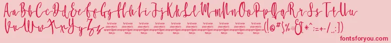 MollucaFree-Schriftart – Rote Schriften auf rosa Hintergrund