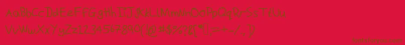 Czcionka Macshandwriting – brązowe czcionki na czerwonym tle