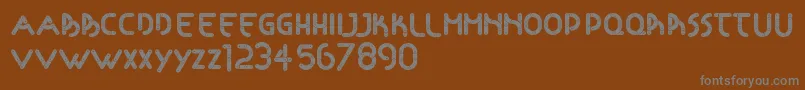 Articulada Font – Gray Fonts on Brown Background