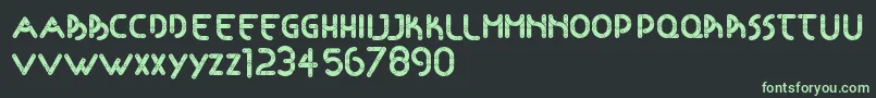 Articulada Font – Green Fonts on Black Background