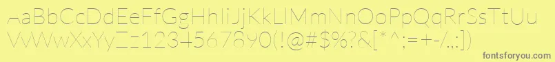 LatoHairline-fontti – harmaat kirjasimet keltaisella taustalla