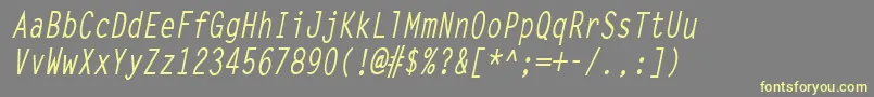 LettergothiccondBoldItalic-fontti – keltaiset fontit harmaalla taustalla