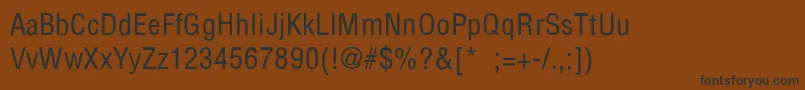 フォントPartridgeCondensedThin – 黒い文字が茶色の背景にあります