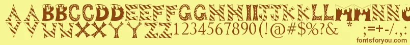 フォントDropOfFun – 茶色の文字が黄色の背景にあります。