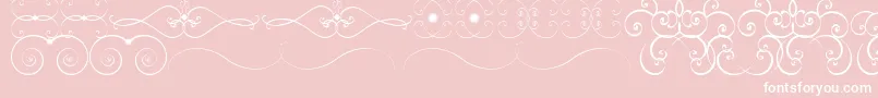 Czcionka OrnametssTfb – białe czcionki na różowym tle