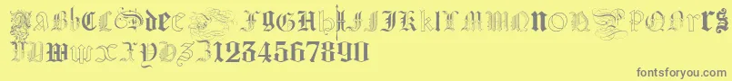 Шрифт KidnappedAtGermanLands – серые шрифты на жёлтом фоне