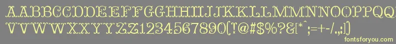 MadameBovaryNormal-fontti – keltaiset fontit harmaalla taustalla