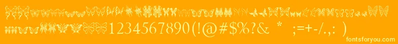 TribalButterflies-Schriftart – Gelbe Schriften auf orangefarbenem Hintergrund