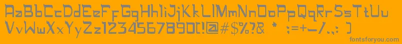 Rugamika-fontti – harmaat kirjasimet oranssilla taustalla