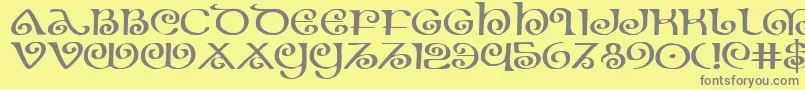 フォントTheShireExpanded – 黄色の背景に灰色の文字