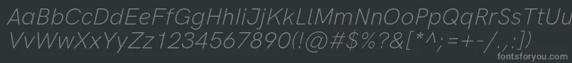 フォントHkgroteskLightlegacyitalic – 黒い背景に灰色の文字