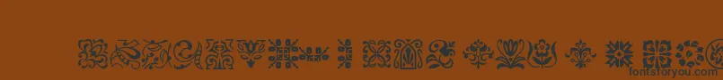 Ptornament-Schriftart – Schwarze Schriften auf braunem Hintergrund
